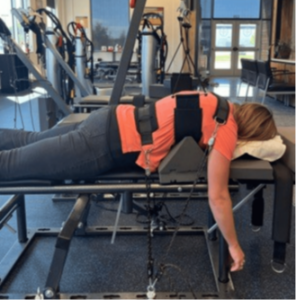 patient is prone to a force used to increase thoracic curvature and induce posterior thoracic translation